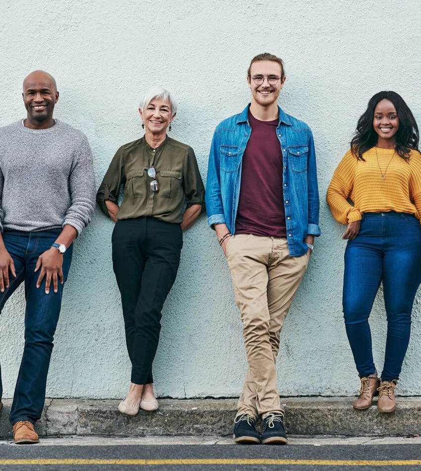 A group of church members standing together against a wall
