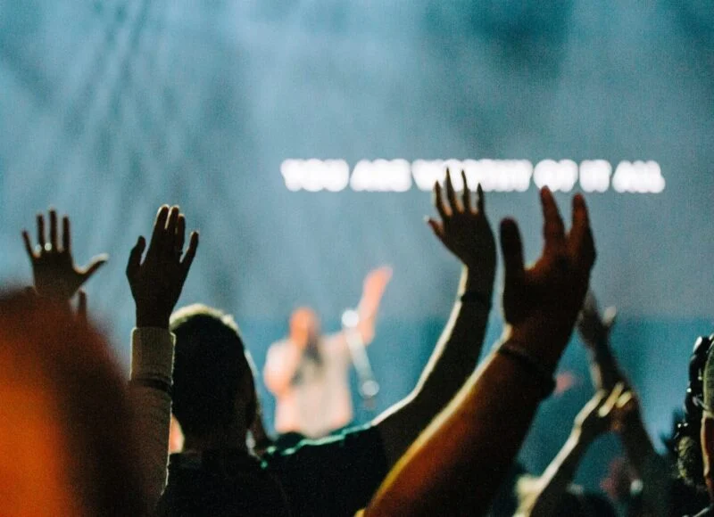 Hands raised in worship during a service