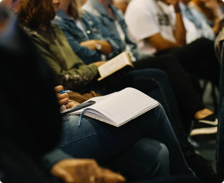 A person journaling at a church event