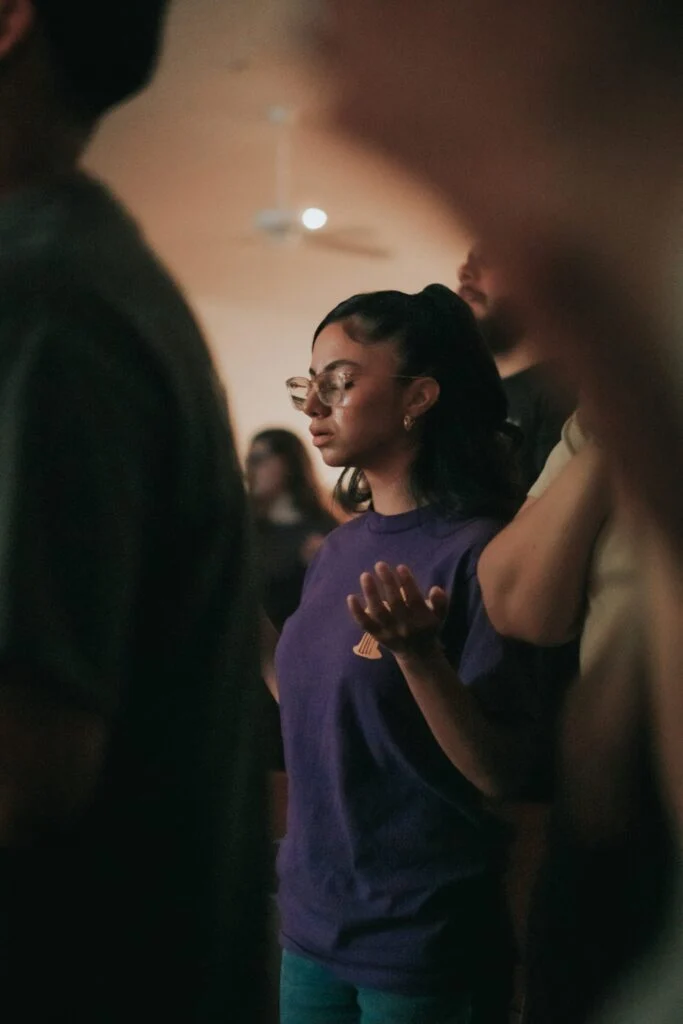 A worship leader singing during an online campus service